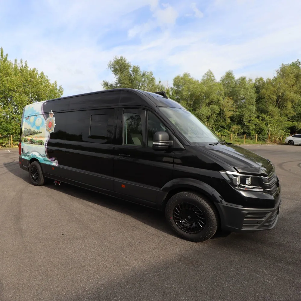 The front end of a black VW Crafter LWB.