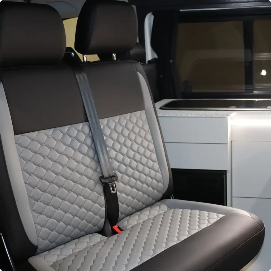 Seated interior with diamond stitching inside capervan