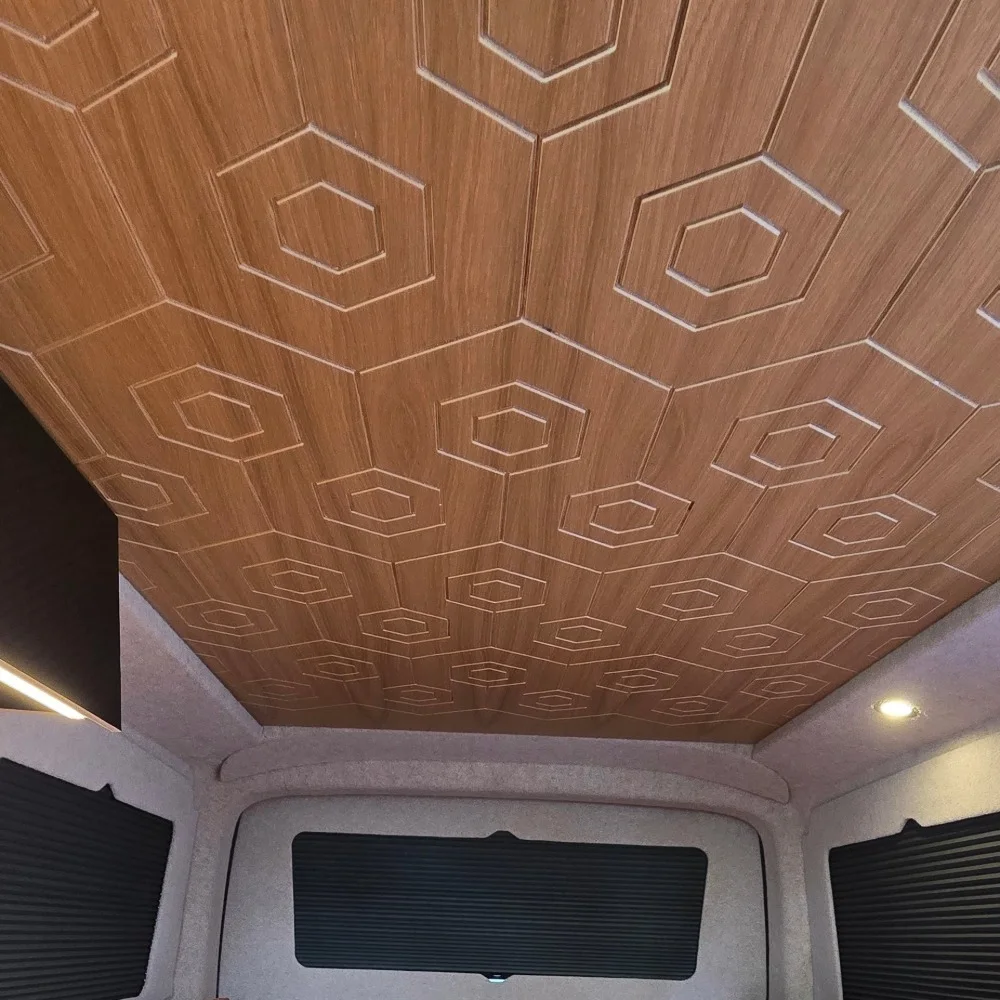 A wood finish ceiling with a hexagonal pattern.
